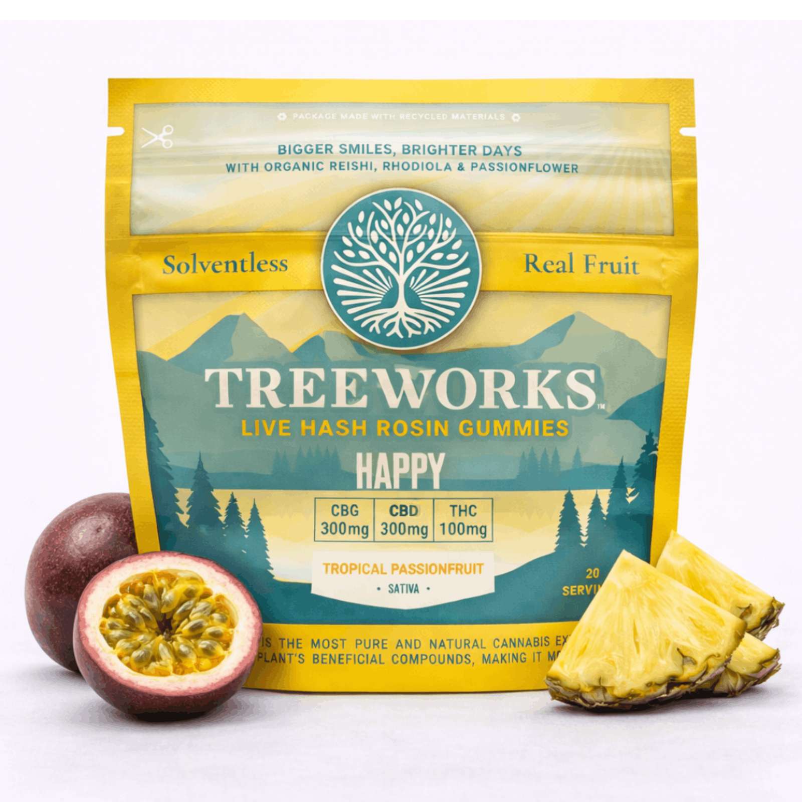 Bright yellow bag of Tree Works live hash rosin gummies, teal tree emblem, with passionfruit and pineapple slices placed beside it.