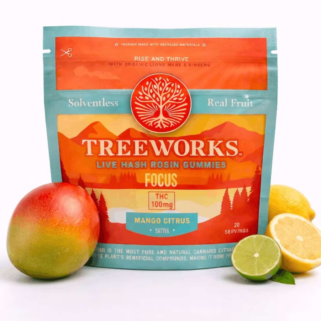 Bag of Tree Works real fruit mango citrus cannabis gummies with mangoes and lime slices around it, bright orange-teal packaging.